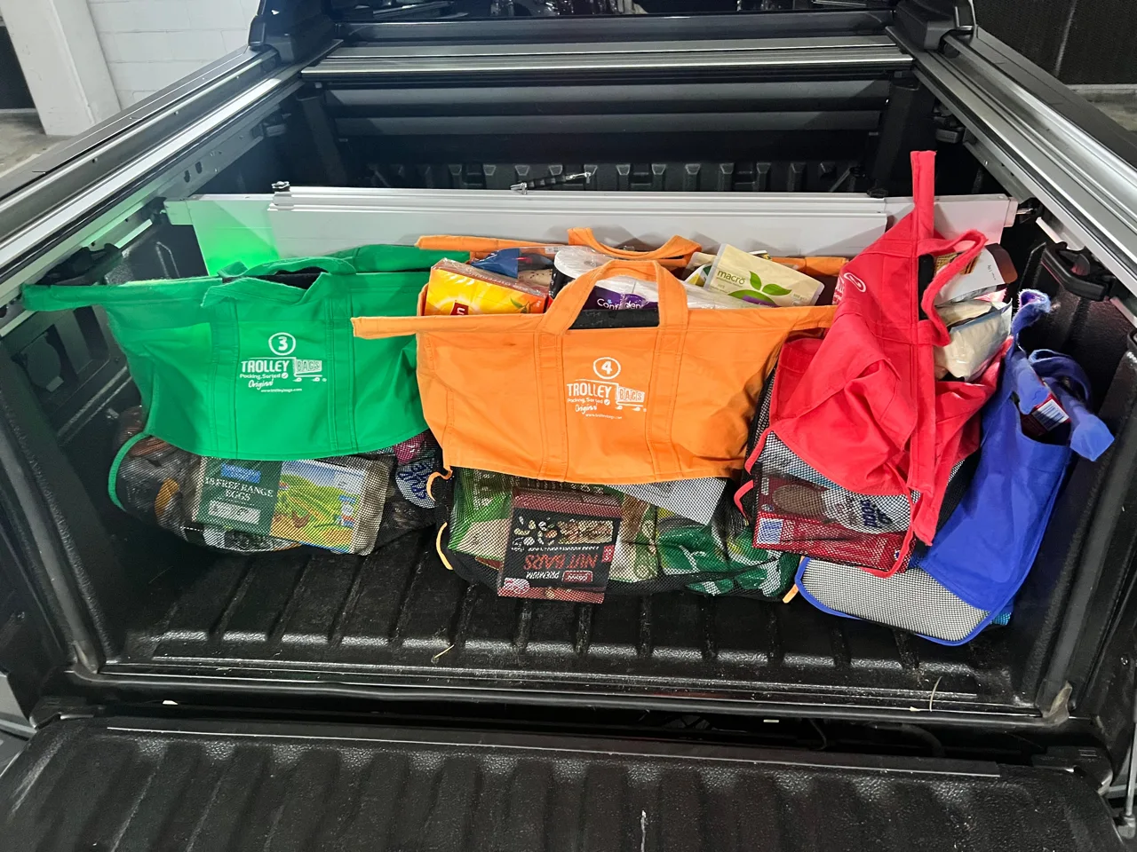 Prototype divider keeping grocery bags near the tailgate