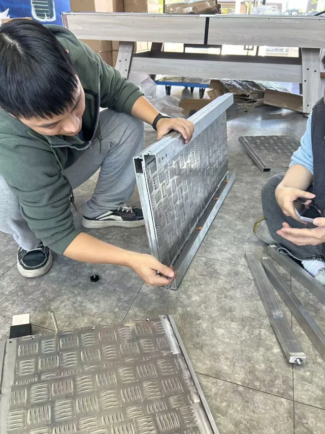 Engineers assembling and assessing the first prototype